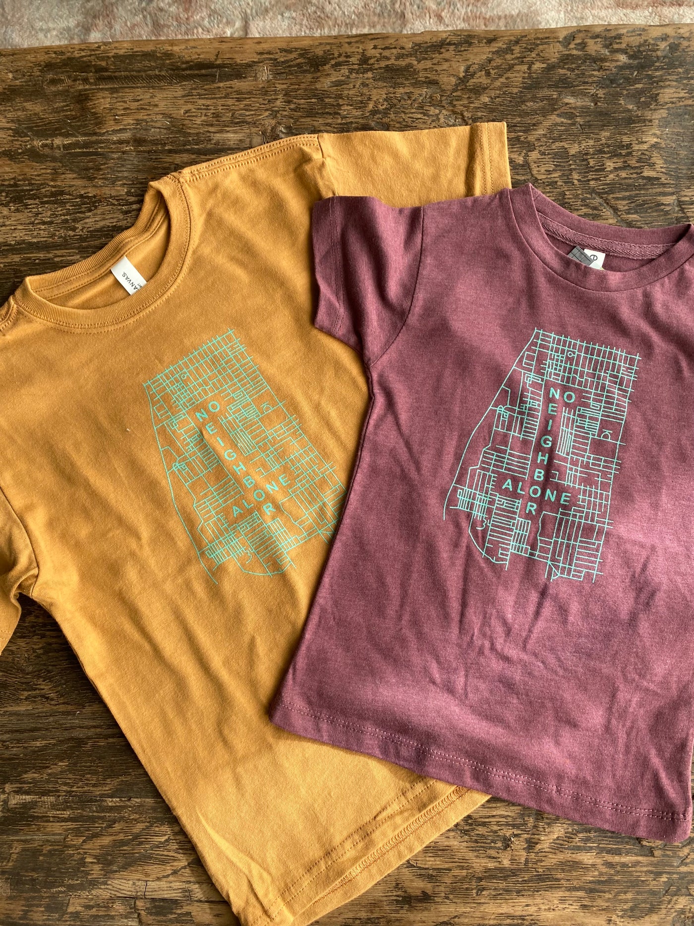 "No neighbor alone" kids shirts
